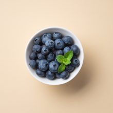 fresh-juicy-blueberries-with-mint-in-a-white-bow